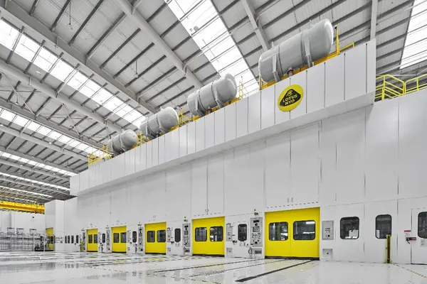 A large white and yellow warehouse

Description automatically generated
